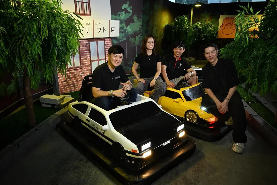 from left: Dorifto! co-founders Shane Ang, Gladys Lam, Kenneth Ho and Shawn Ang with the drift karts styled after the Toyota AE86 and Mazda RX-7 at the indoor drift circuit on April 14, 2026.