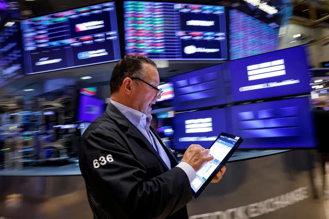 A trader works on the floor at the New York Stock Exchange, in New York City. 