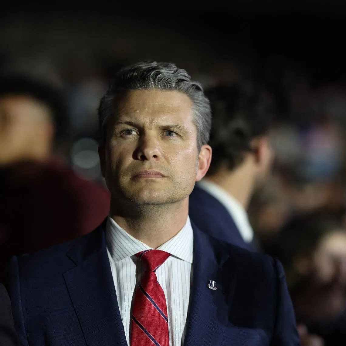 WARREN, MICHIGAN - APRIL 29: Defense Secretary Pete Hegseth listens as President Donald Trump speaks during a rally at Macomb Community College on April 29, 2025 at Warren, Michigan. Trump held the rally to highlight his accomplishments during his first 100 days in office, including closing the border, job creation and the economy. Scott Olson/Getty Images/AFP (Photo by SCOTT OLSON / GETTY IMAGES NORTH AMERICA / Getty Images via AFP)