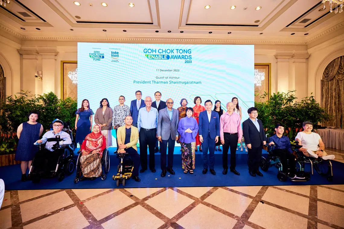 Emeritus Senior Minister Goh Chok Tong (front row, fifth from left), President Tharman Shanmugaratnam and his wife Jane Ittogi at the Goh Chok Tong Enable Awards ceremony on Dec 11.