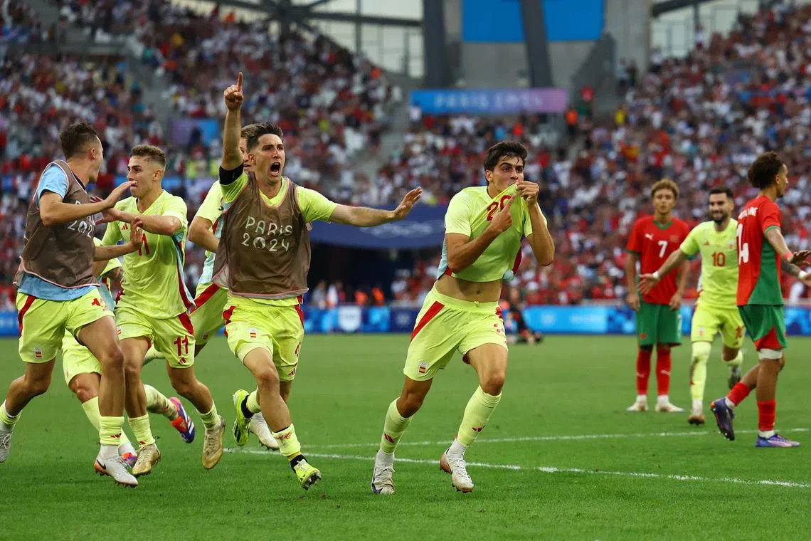 Paris 2024 Olympics - Football - Men's Semi-final - Morocco vs Spain - Marseille Stadium, Marseille, France - August 05, 2024. Juanlu Sanchez of Spain celebrates scoring their second goal with teammates. REUTERS/Luisa Gonzalez