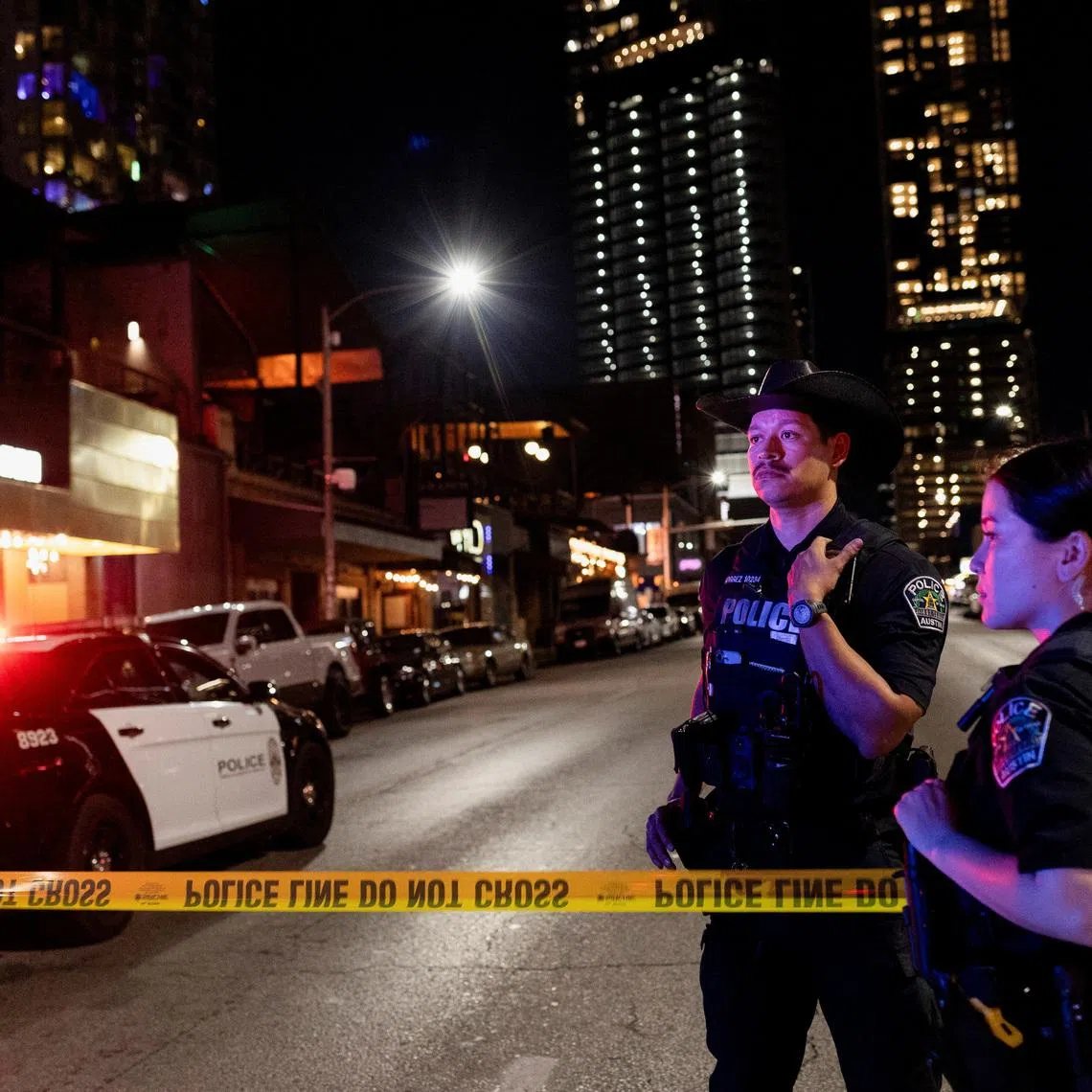 Austin police officers work at the scene after a deadly mass shooting outside Buford's, a popular roadhouse-style bar in Austin, Texas, U.S. March 1, 2026. REUTERS/Nuri Vallbona