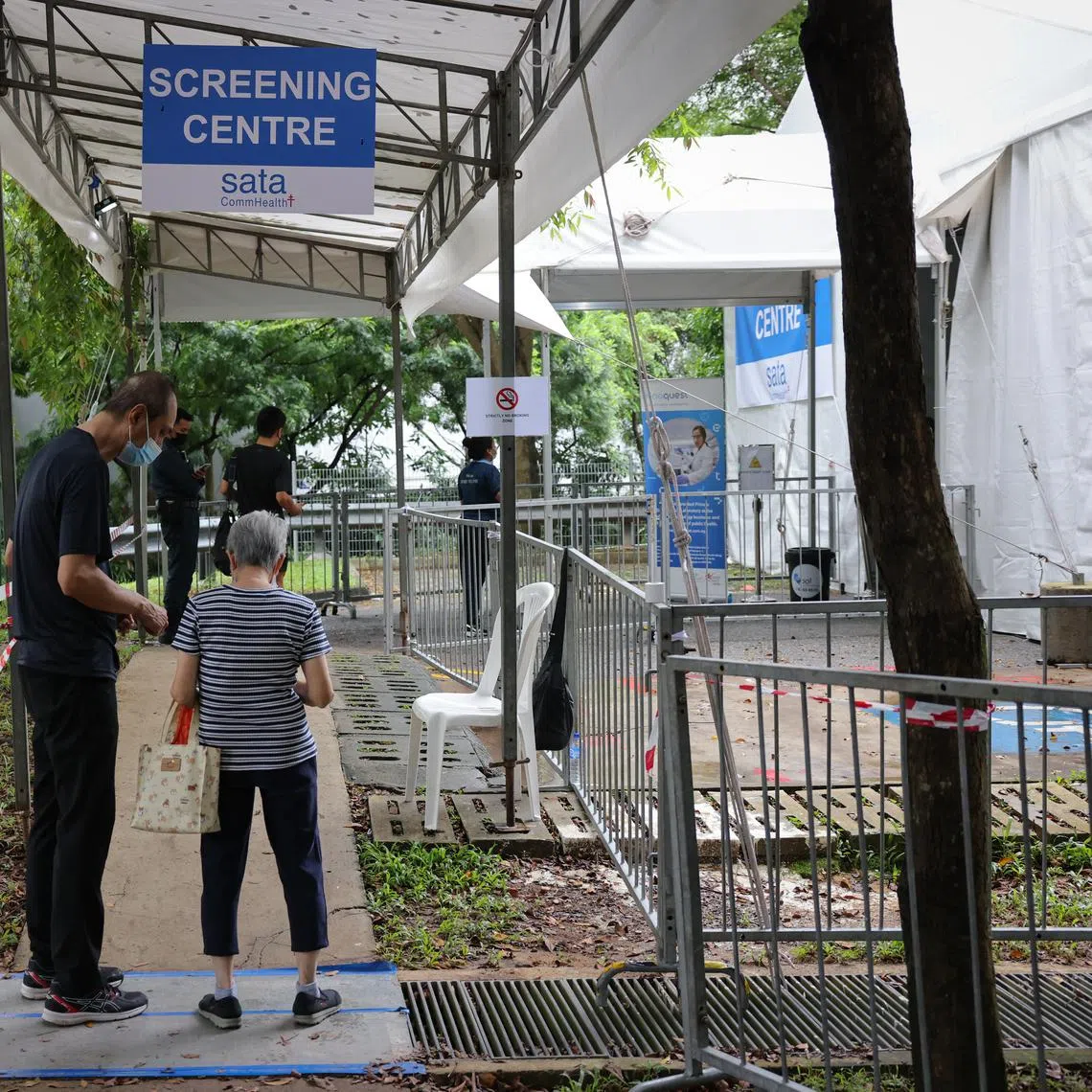 A tent has been set up at an open car park in the area for the screening for workers at the food centre and market.