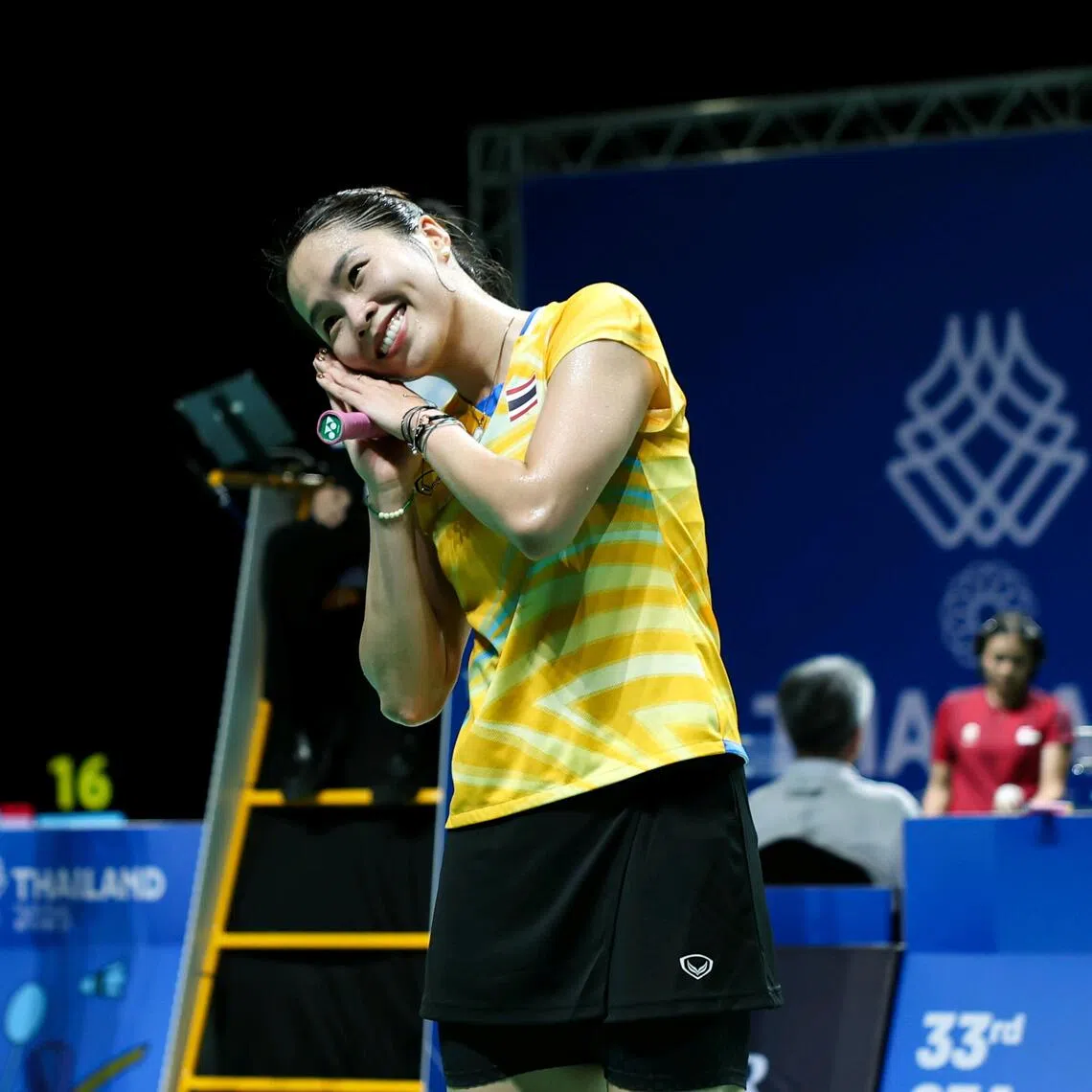 Ratchanok Intanon celebrates with Steph Curry's night night pose after helping Thailand beat Singapore 3-0 in the SEA Games badminton women's team semi-final at the Thammasat University on Dec 8.