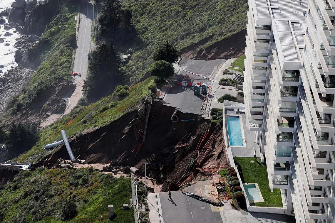 A view of a massive landslide next to a building complex, after heavy rains hit Concon, Chile, Sept 11.