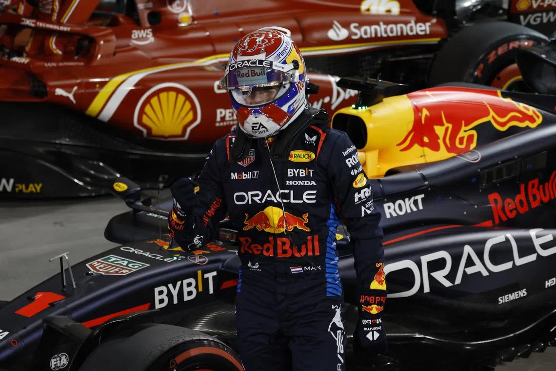 Red Bull's Max Verstappen celebrates after qualifying in pole position.