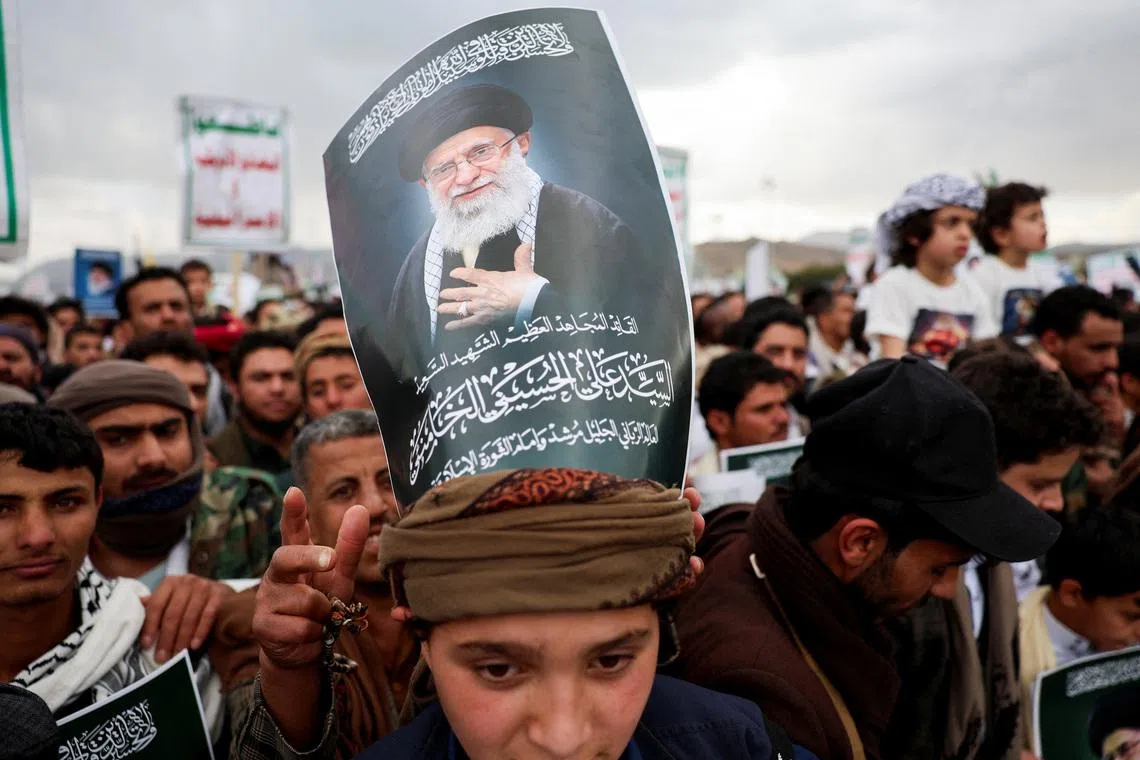 A protester with a poster on his head featuring a picture of late Iran's Supreme Leader Ayatollah Ali Khamenei joins a demonstration with Houthi supporters in solidarity with Iran and Lebanon, amid the U.S.-Israeli conflict with Iran, in Sanaa, Yemen March 6, 2026. REUTERS/Khaled Abdullah