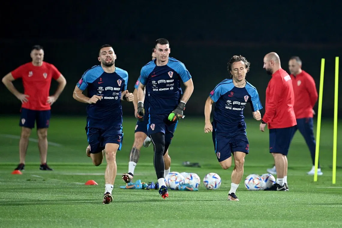 From left: Croatia's Mateo Kovacic, Dominik Livakovic and Luka Modric taking part in a training session in Doha on Nov 18, ahead of their World Cup opener against Morocco on Nov 23.