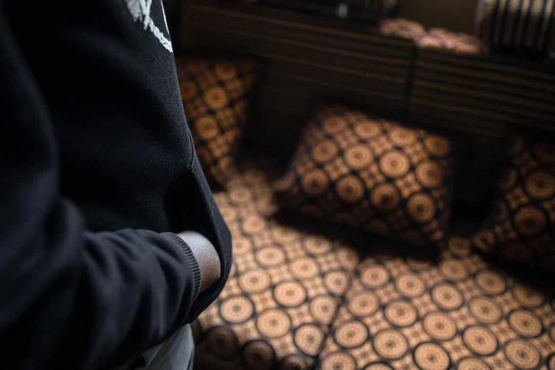 Jalil Muyeke at his home in Uganda in July 2024. Muyeke survived a harrowing ordeal in Myanmar, where he was trafficked and forced to commit online scams. 