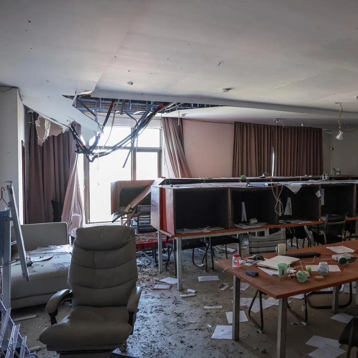 Rows of small boxes lined with acoustic foam, used by scammers to make calls to victims, are seen amid debris and a partially collapsed ceiling inside a compound in O’Smach used for scam operations in Samraong, Oddar Meanchey province, in Cambodia on Feb 2, 2026.