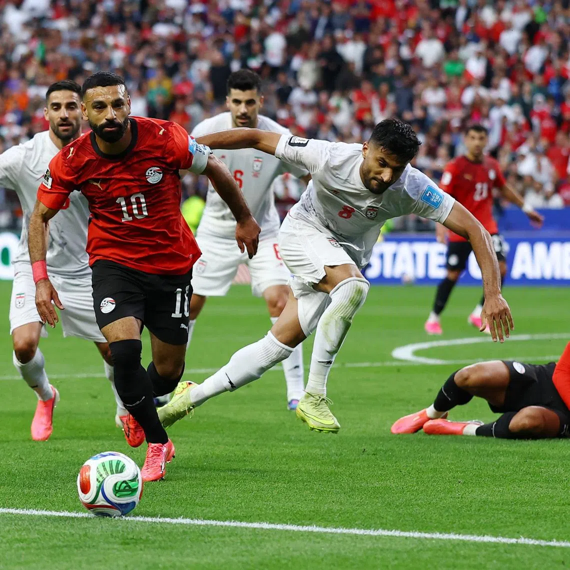 Soccer Football - FIFA World Cup 2026 - Group G - Egypt v Iran - Seattle Stadium, Seattle, Washington, U.S. - June 26, 2026 Egypt's Mohamed Salah in action with Iran's Mohammad Mohebbi REUTERS/Matthew Childs