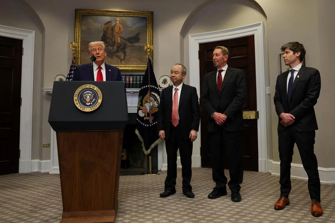 Mr Trump delivers remarks on AI infrastructure, next to (left to right) SoftBank CEO Masayoshi Son. Oracle co-founder Larry Ellison and OpenAI CEO Sam Altman.