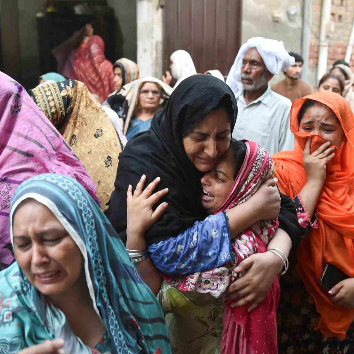 Relatives of the children who reportedly died after a tuition center roof collapsed, mourn in Lahore, Pakistan, June 30, 2026. REUTERS/Murtaza Ali
