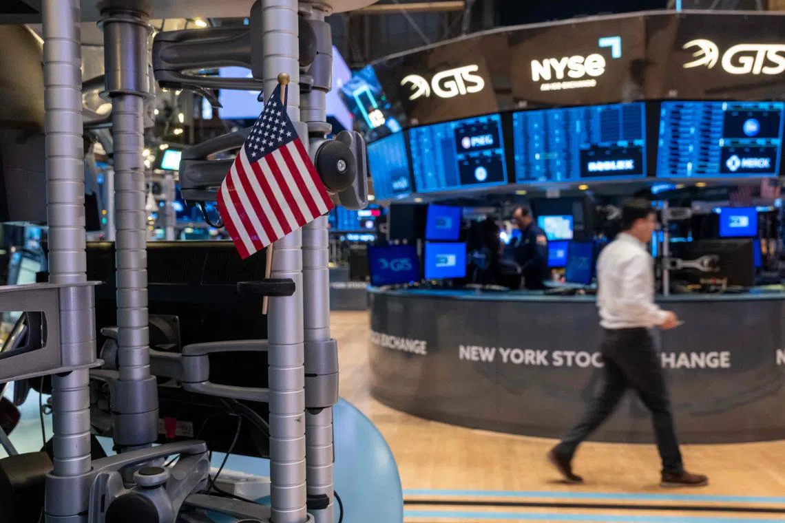 Traders work on the floor of the New York Stock Exchange, in New York City. 