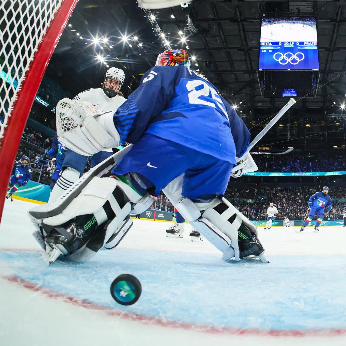 Milano Cortina 2026 Olympics - Ice Hockey - Women's Preliminary Round - Group B - Italy vs France - Milano Santagiulia Ice Hockey Arena, Milan, Italy - February 05, 2026. Martina Fedel of Italy in action as France's first goal is scored by Gabrielle de Serres of France REUTERS/Gregory Shamus