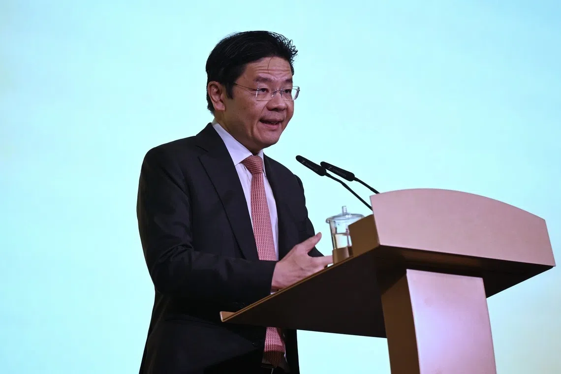 PM Lawrence Wong delivering a speech at the Singapore Chinese Chamber of Commerce & Industry 120th anniversary gala dinner on Oct 30.