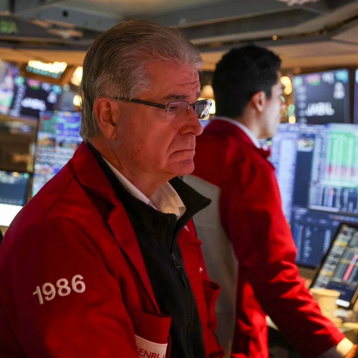 Traders working on the floor of the New York Stock Exchange on Oct 6, before the closing bell, in New York City.