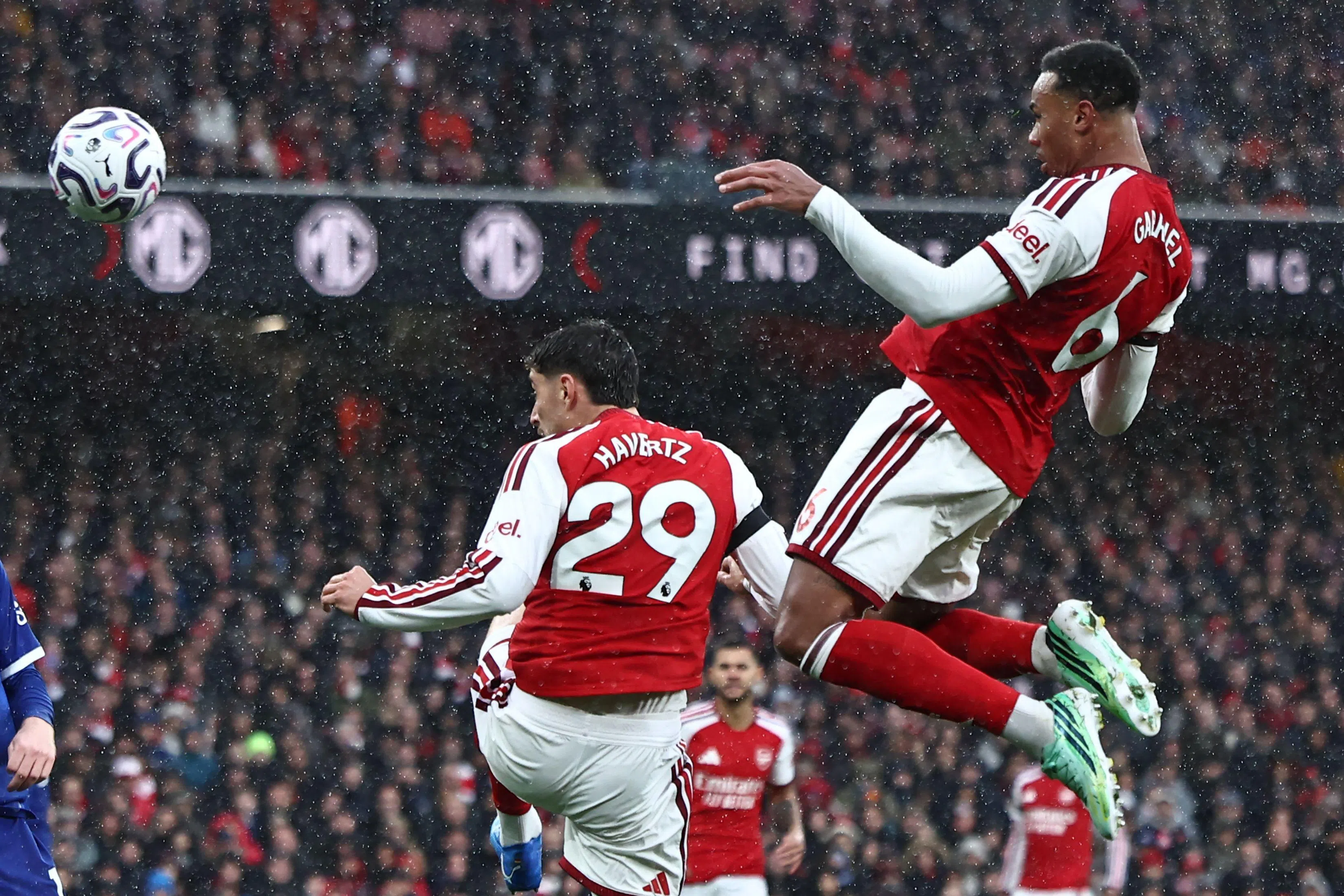 Arsenal’s Brazilian defender Gabriel Magalhaes (right) heads home their second goal against Everton.