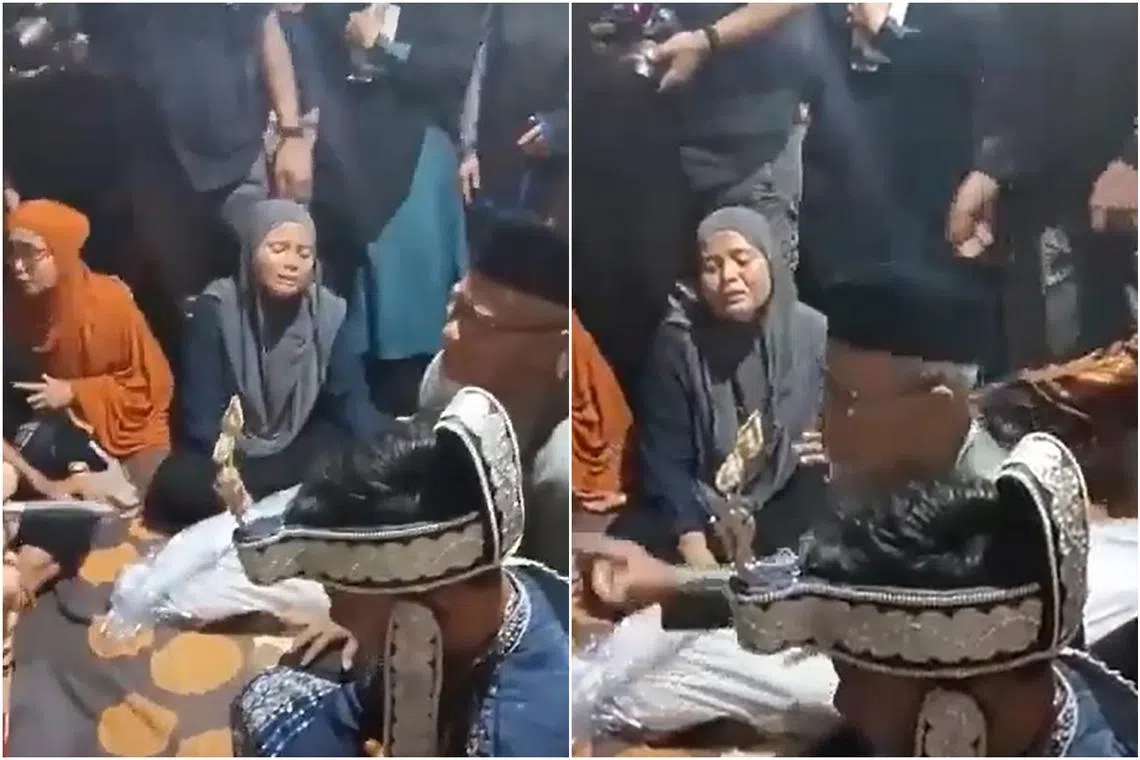 The body of the bride’s father, wrapped in a white shroud, was next to the couple, while a male relative gave Ms Tarisa away. 