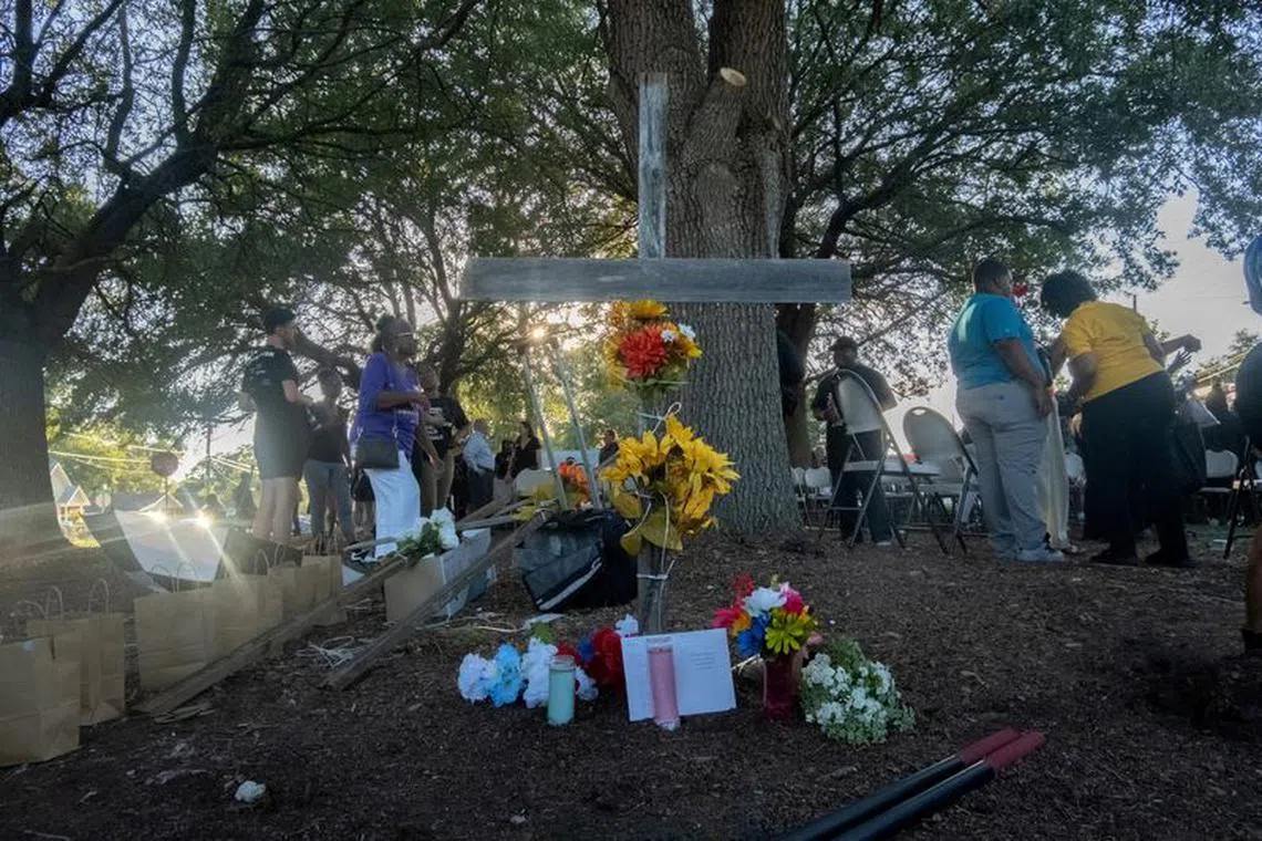 Mourners attend a prayer vigil a day after a white man armed with a high-powered rifle and a handgun killed three Black people at a Dollar General store before shooting himself, in what local law enforcement described as a racially motivated crime in Jacksonville, Florida, U.S. August 27, 2023.  REUTERS/Malcom Jackson