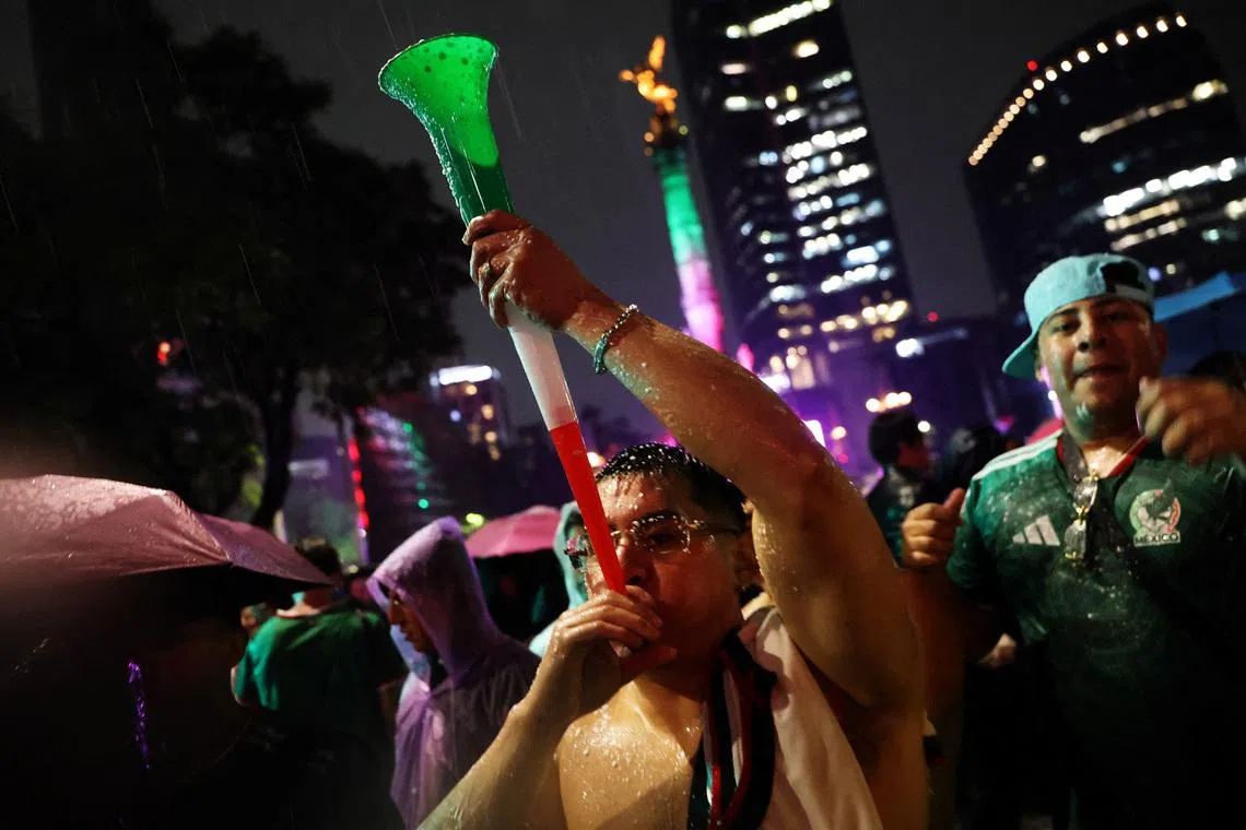 The Angel of Independence is seen as Mexico fans celebrate in the rain after the Czech Republic v Mexico match REUTERS/Luis Cortes