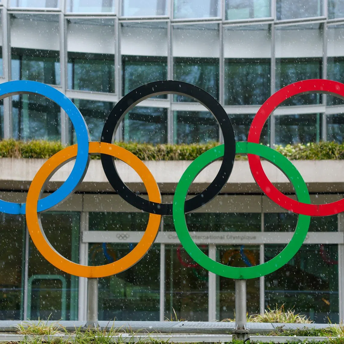 Olympic rings are pictured outside the International Olympic Committee (IOC) during an Executive Board meeting at the Olympic House in Lausanne, Switzerland, March 26, 2026. REUTERS/Denis Balibouse