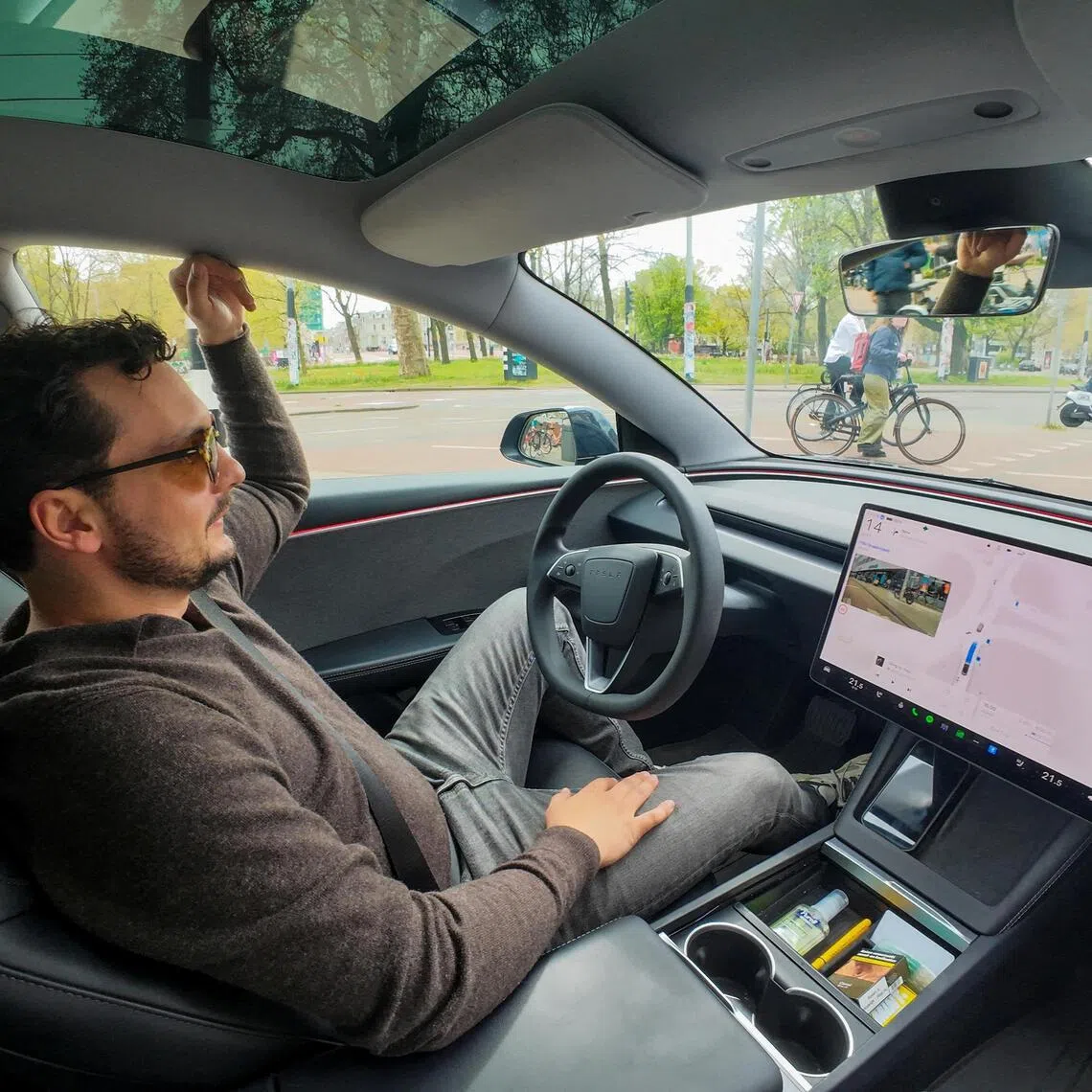 FILE PHOTO: Tesla enthusiast Kees Roelandschap drives around hands-free with his electric car, several days after Dutch regulators approved the use of Tesla's self-driving software, in Amsterdam, Netherlands, April 17, 2026. REUTERS/Bart Biesemans/File Photo