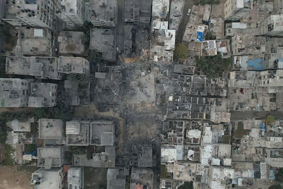 A view of the remains of a mosque and houses destroyed by Israeli strikes in the central Gaza Strip October 29, 2023. REUTERS/Mohammed Fayq Abu Mostafa