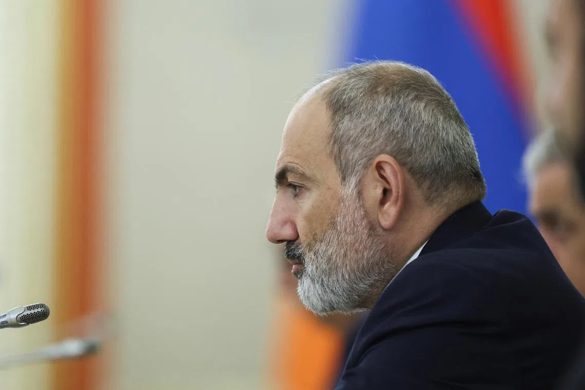 FILE PHOTO: Armenian Prime Minister Nikol Pashinyan attends a meeting with Russian President Vladimir Putin on the sidelines of a summit of leaders of nations, which are members of the Commonwealth of Independent States (CIS), at the Kremlin in Moscow, Russia October 8, 2024. Sergei Ilnitsky/Pool via REUTERS/File Photo
