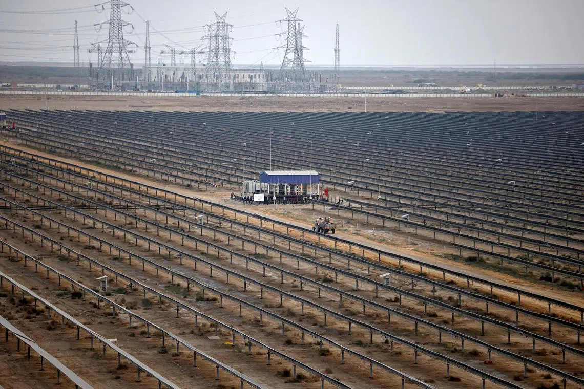 FILE PHOTO: A general view of installed solar panels at the Khavda Renewable Energy Park of Adani Green Energy Ltd (AGEL), in Khavda, India, April 12, 2024. REUTERS/Amit Dave/File Photo