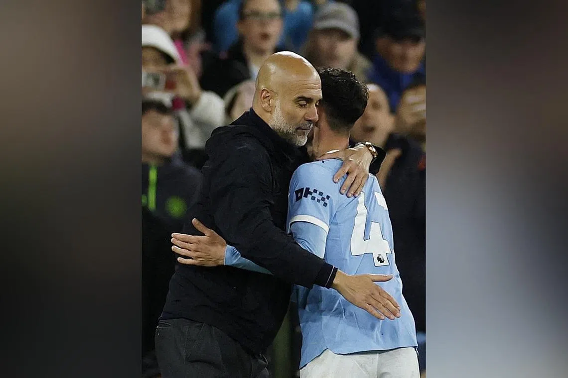 Manchester City manager Pep Guardiola embraces Phil Foden during the 3-0 Premier League win over Crystal Palace.