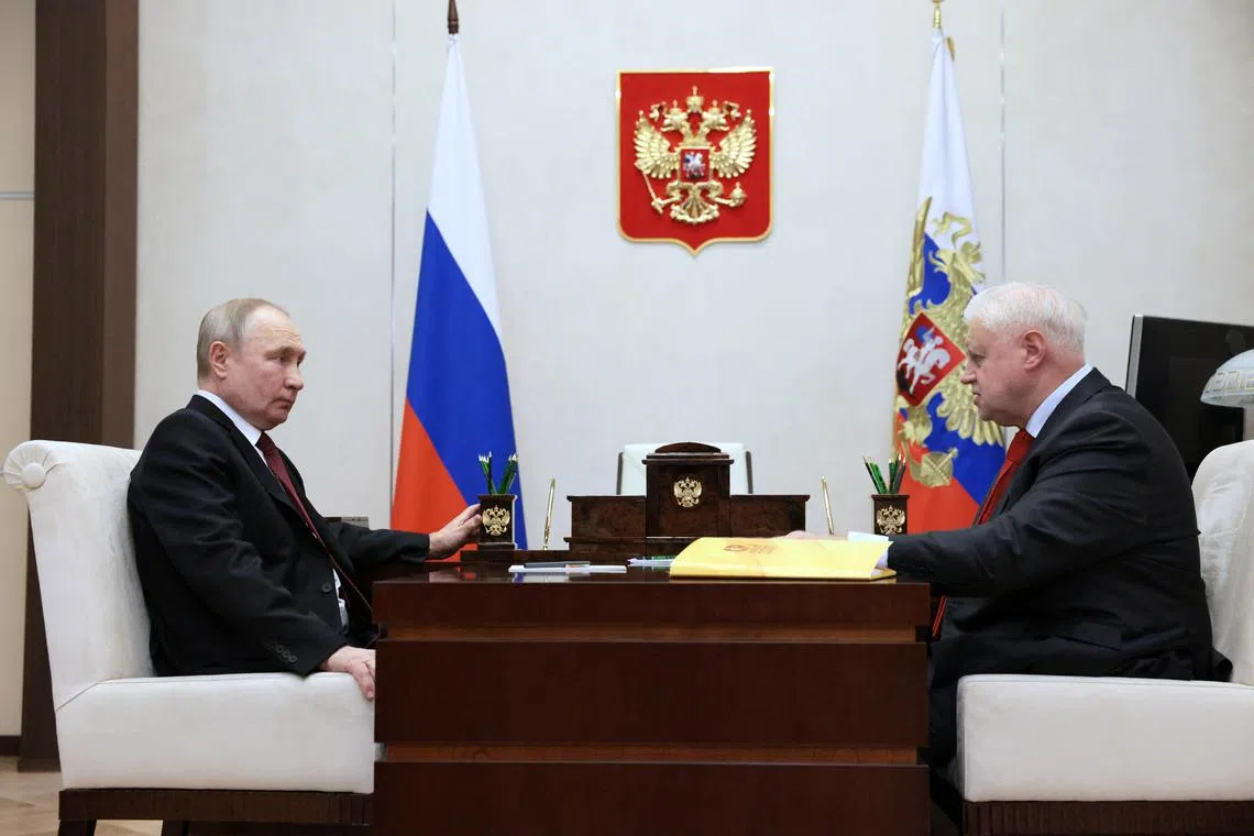 Russian lawmaker Sergei Mironov (right) meeting Russian President Vladimir Putin, who is the subject of an International Criminal Court arrest warrant over the transfer of children from Ukraine to Russia.