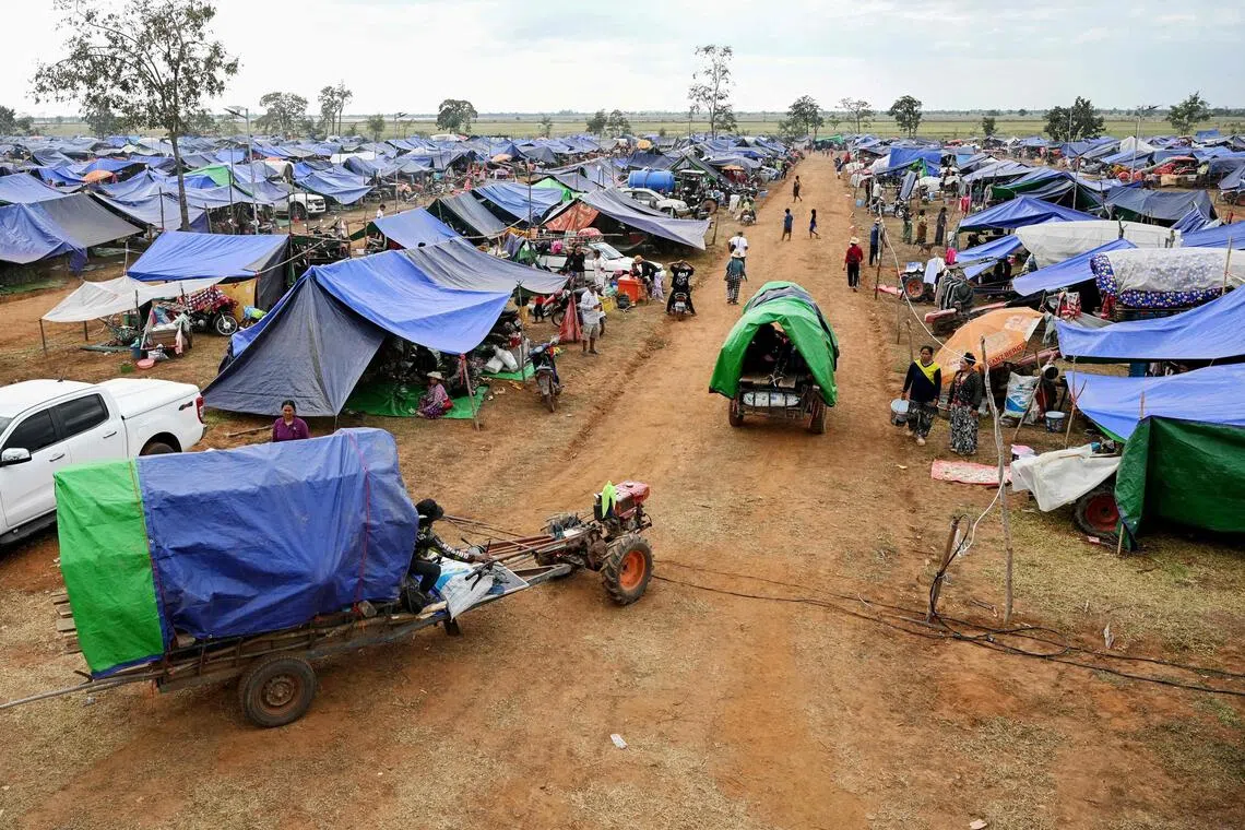 Displaced people arrive at a temporary camp in Cambodia's Oddar Meanchey province on December 11, 2025, amid clashes along the Cambodia-Thailand border. Renewed fighting raged at the border of Cambodia and Thailand on December 11, with combat heard near centuries-old temples, ahead of an expected phone call from US President Donald Trump to the two nations' leaders. (Photo by TANG CHHIN Sothy / AFP)