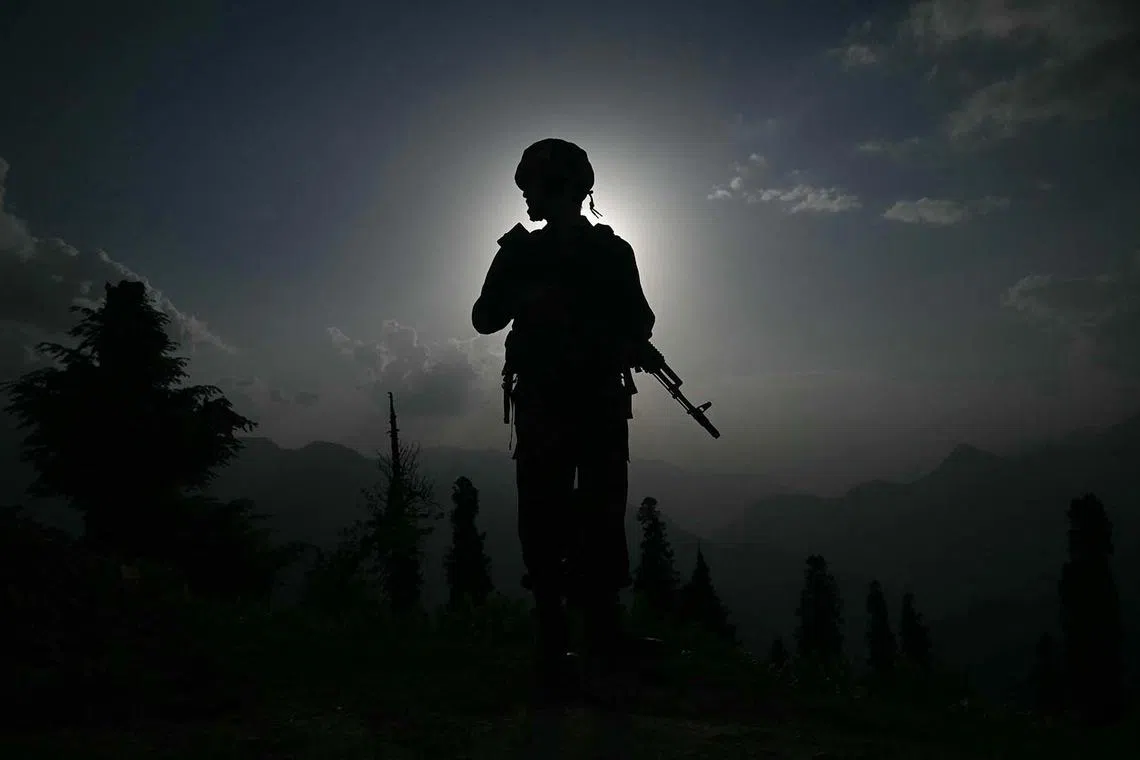 An Indian army soldier standing guard near the Line of Control in India's Kashmir region on May 19, 2025. 