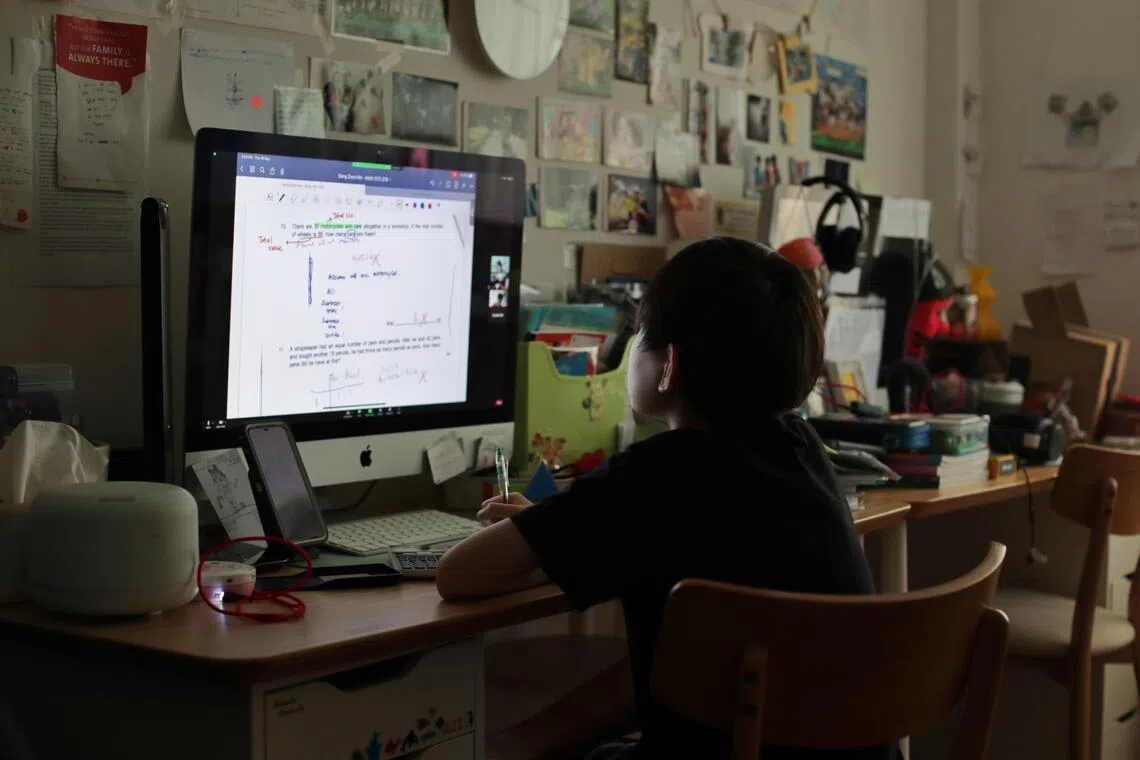 ST20230521_202313789561 : Gin Tay / pixgeneric/

Generic photo of a primary student in a zoom session at home on May 18, 2023.

Can use for stories on PSLE, zoom, online learning, tuition, HBL, home base learning, examinations, test, primary school student, stress, preparation,