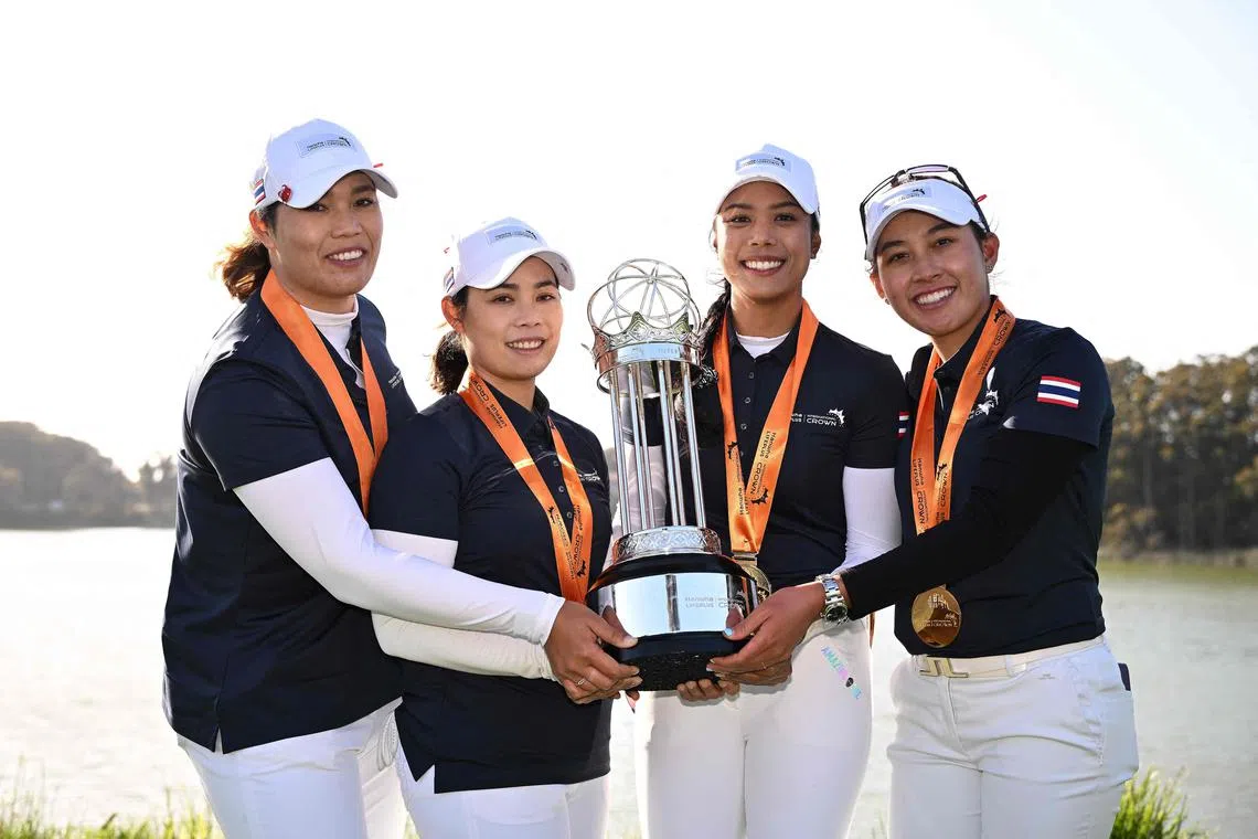 Ariya Jutanugarn (left to right), Moriya Jutanugarn, Patty Tavatanakit and Atthaya Thitikul of Thailand posing with the trophy after defeating Australia in the championship match in the LPGA International Crown at TPC Harding Park in San Francisco.