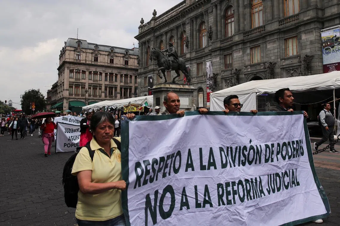 FILE PHOTO: Demonstrators walk in front of the The National Art Museum (MUNAL) as they protest along the streets after a highly contested judicial reform proposal was passed in the Senate in Mexico City, Mexico September 12, 2024. REUTERS/Henry Romero/File Photo