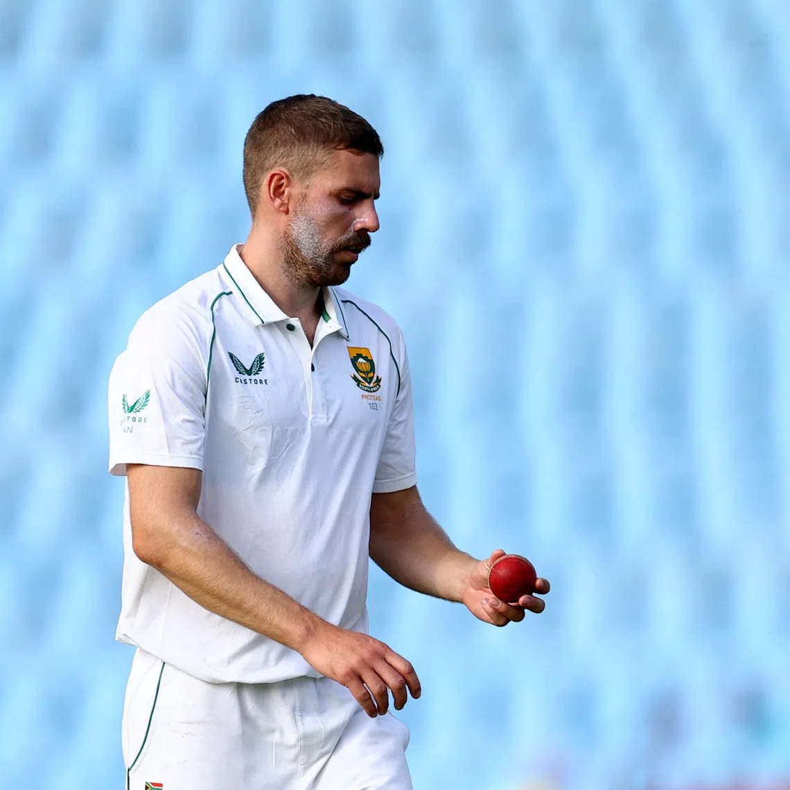 Cricket - First Test - South Africa v West Indies - SuperSport Park Cricket Stadium, Centurion, South Africa - March 1, 2023 South Africa's Anrich Nortje looks at the ball before bowling REUTERS/Siphiwe Sibeko/File Photo