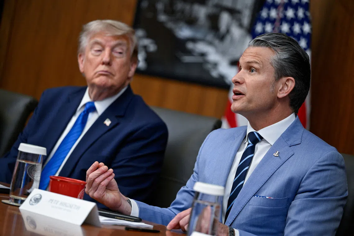 US President Donald Trump listens as Secretary of Defense Pete Hegseth speaks during a cabinet meeting on Jul 31.