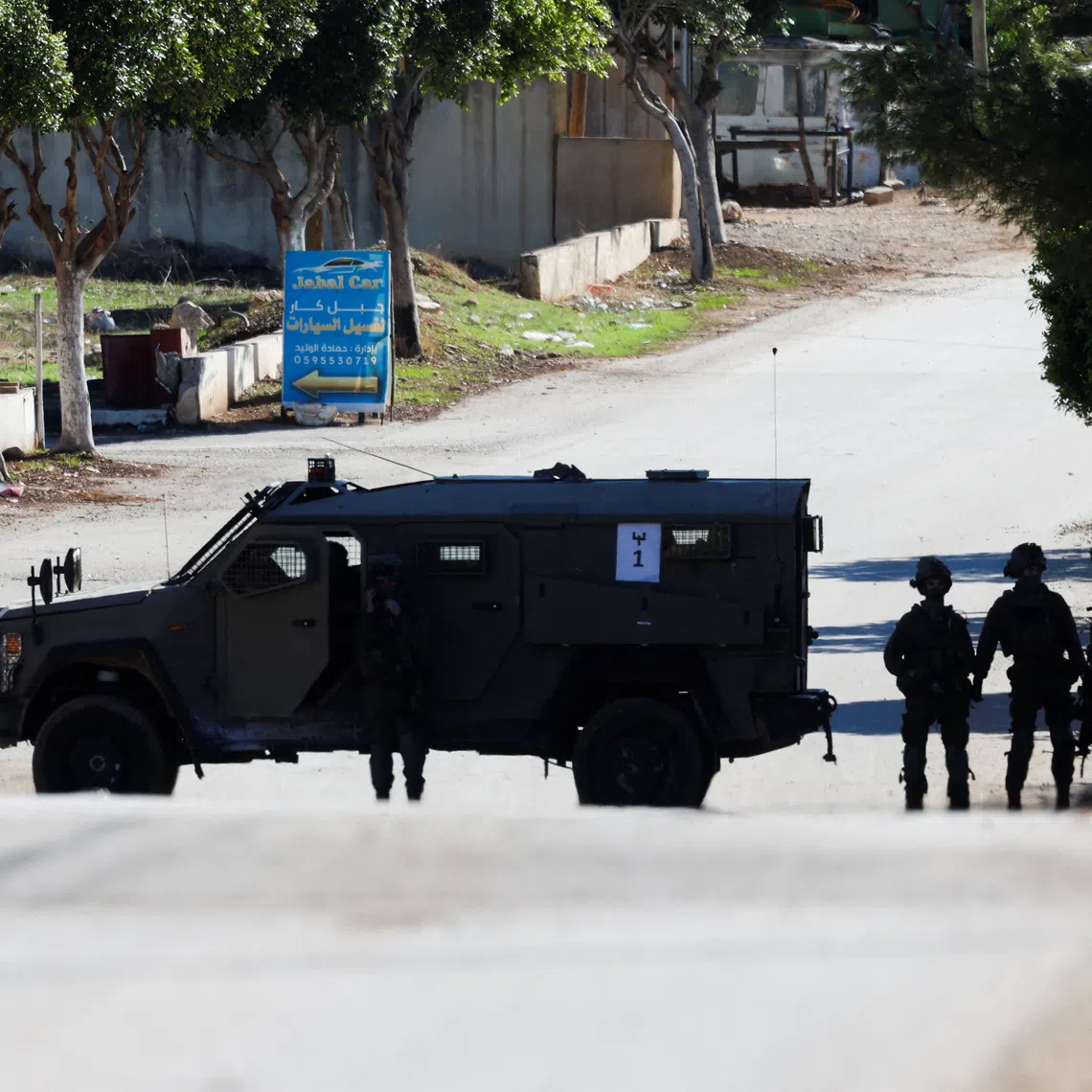 A military vehicle operates during an Israeli raid in Tammun near Tubas in the Israeli-occupied West Bank, November 26, 2025. REUTERS/Mohamad Torokman