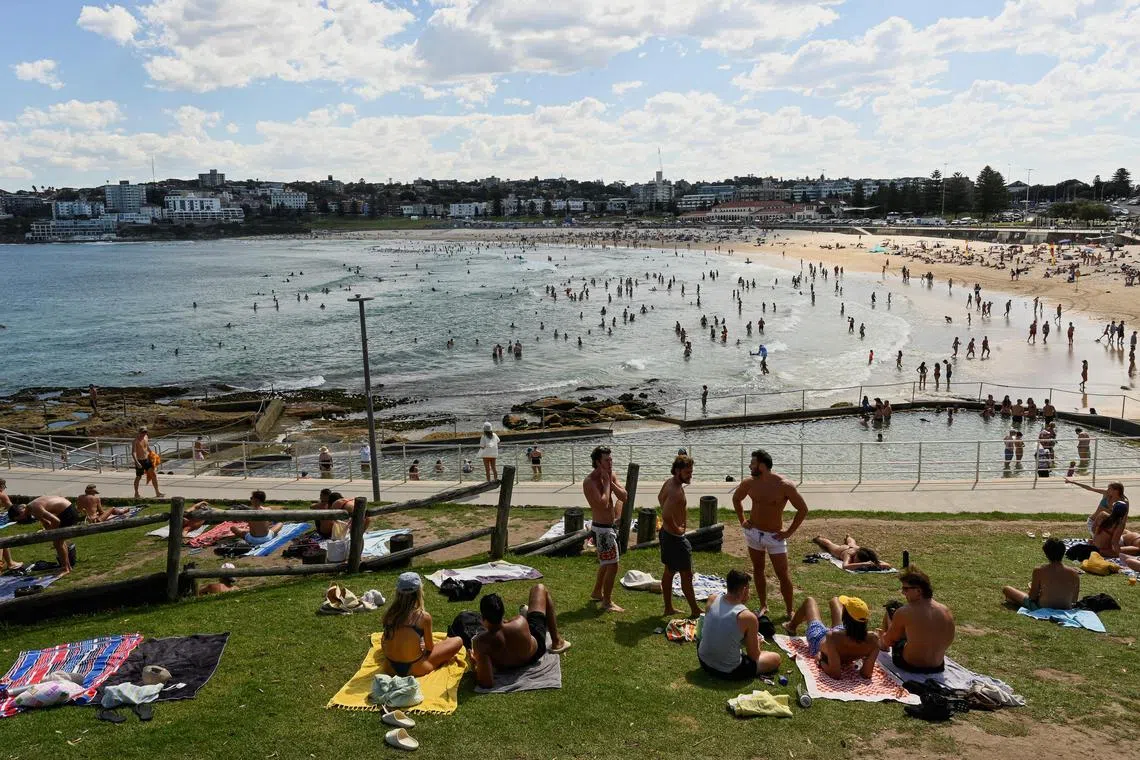 People head to the beach as Australia's east including Sydney reached its hottest day in two years as temperatures rose to 40 deg C.