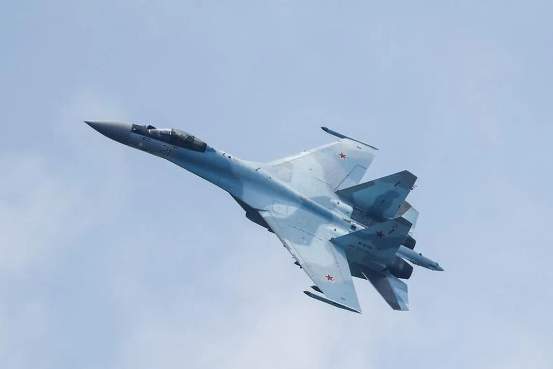 FILE PHOTO: A Russian Sukhoi Su-35S jet fighter performs a flight during the Aviadarts competition, as part of the International Army Games 2021, at the Dubrovichi range outside Ryazan, Russia August 27, 2021. REUTERS/Maxim Shemetov/File photo
