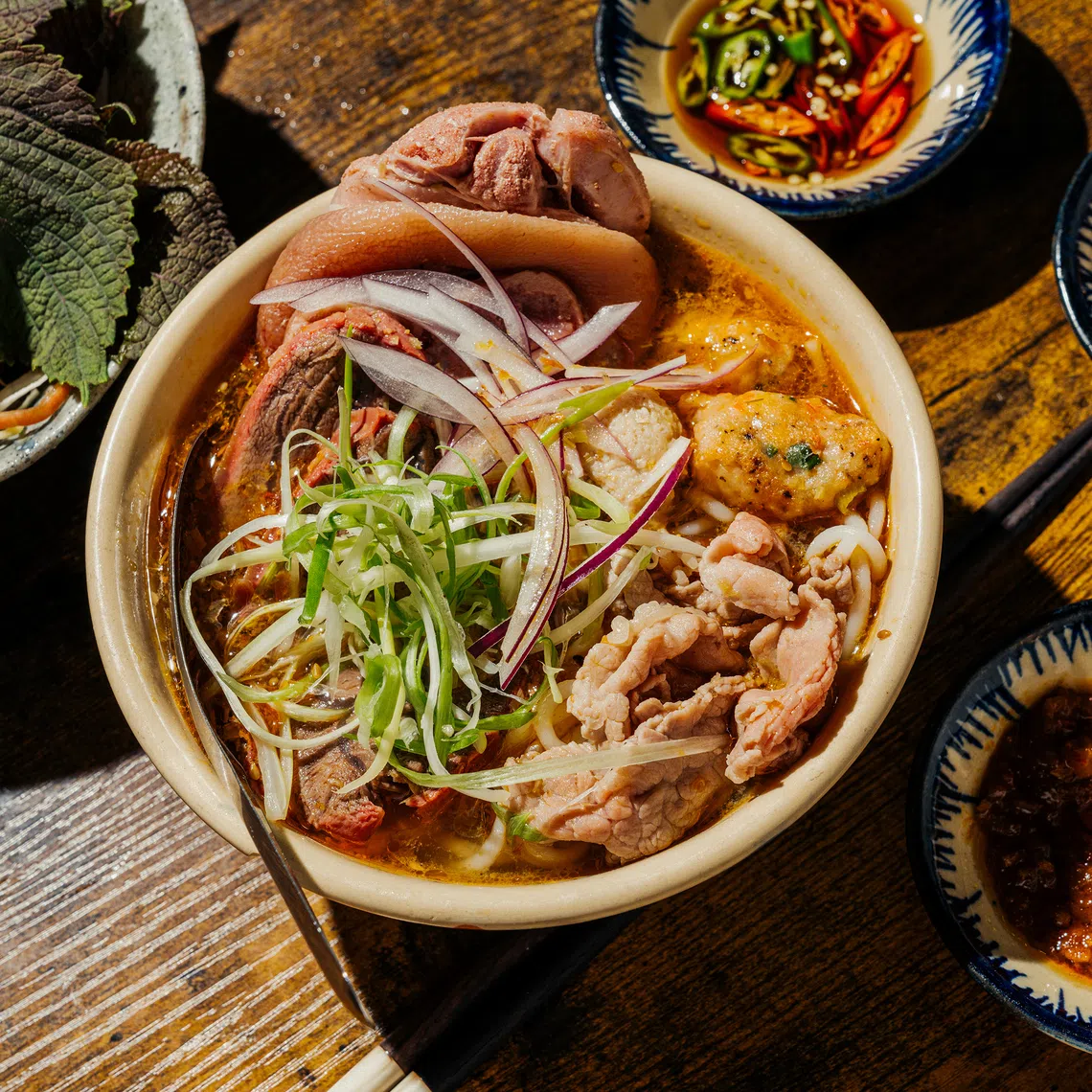 A bowl of bun bo hue, a Vietnamese noodle soup. Millions of people across the world’s hottest places have long known the best way to cool down in the summer is to eat hotter.
