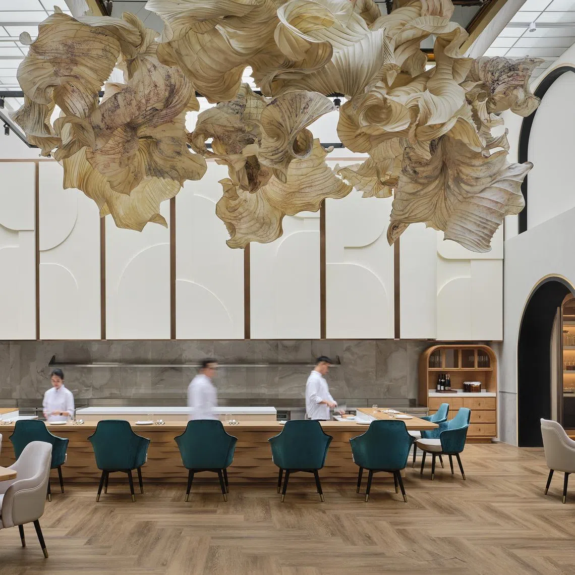 A view of the main dining room at Restaurant Born with its glass ceiling and paper sculpture by Peter Gentenaar. 