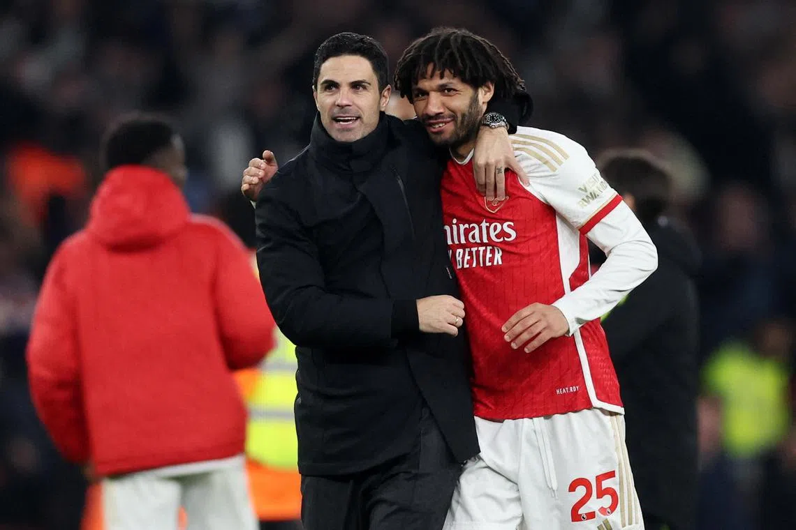 Arsenal manager Mikel Arteta, seen here with Mohamed Elneny, has urged his player to focus on the Brentford match before Liverpool take on Manchester City a day later.
