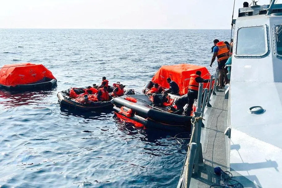 Sri Lanka Navy personnel assist Iranian sailors during a rescue operation after responding to a distress call from their vessel, the Iranian military ship, IRIS Dena, while at sea within Sri Lanka’s maritime search and rescue region, in Indian Ocean, Sri Lanka, March 4, 2026. Sri Lanka Navy/Handout via REUTERS