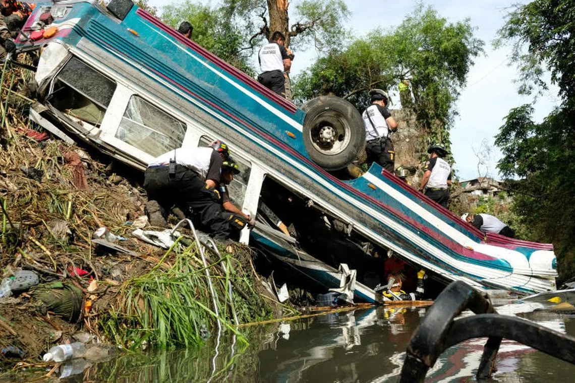 First responders work at the site of a deadly bus crash, in Guatemala City, Guatemala, February 10, 2025. REUTERS/Josue Decavele