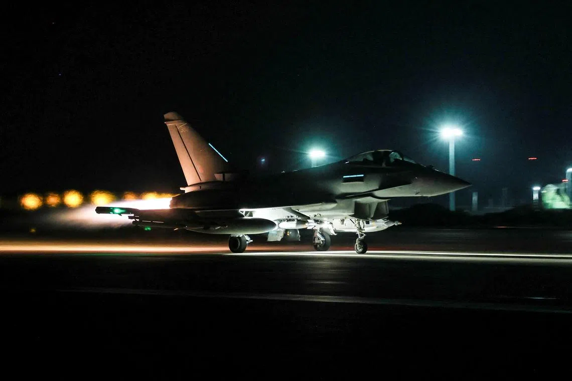 FILE PHOTO: A Royal Air Force Typhoon aircraft is prepared to conduct further strikes against Houthi targets, February 24, 2024. Cpl Tim Laurence RAF/UK MOD/Handout via REUTERS/File Photo