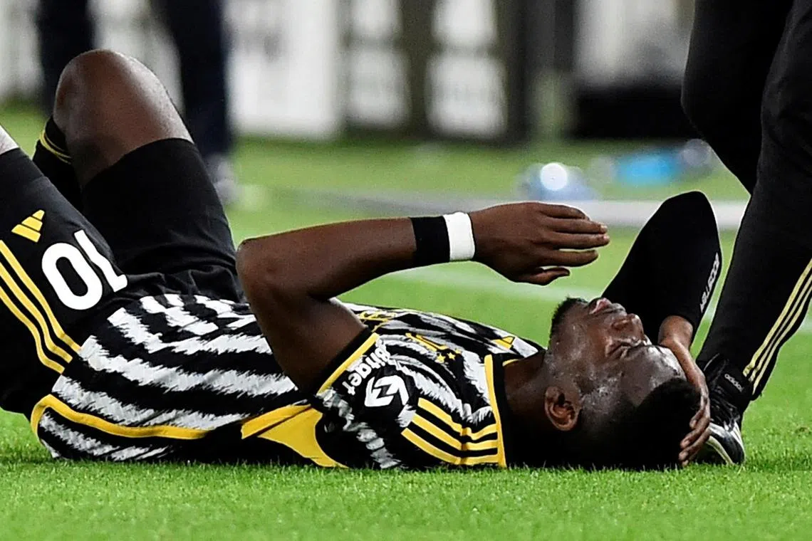FILE PHOTO: Soccer Football - Serie A - Juventus v Cremonese - Allianz Stadium, Turin, Italy - May 14, 2023
Juventus' Paul Pogba down injured REUTERS/Massimo Pinca/File Photo