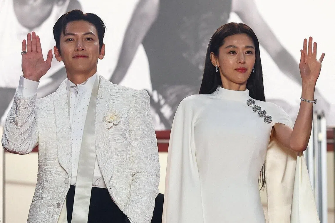 Jun Ji-hyun (right) and Ji Chang-wook at the screening of Colony at the Cannes Film Festival in Cannes, France on May 16.
